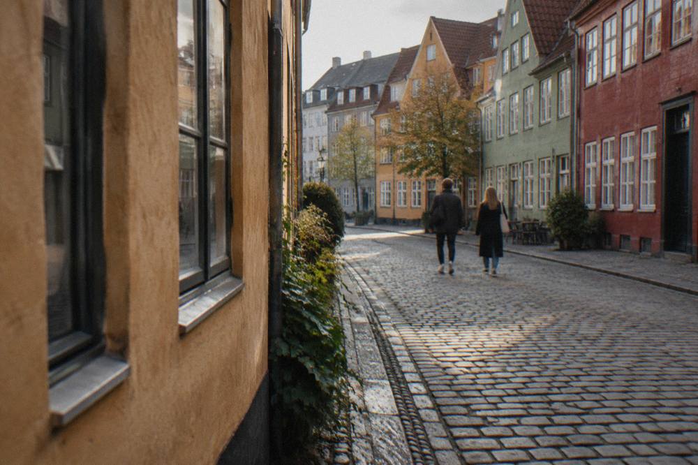 Copenhagen old town street with colourful facades and cyclists