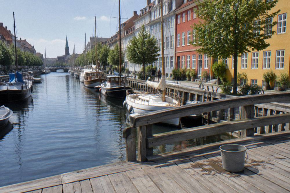 Christianshavn canal with moored boats and colourful houses