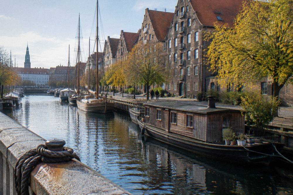 Copenhagen harbour front with historic warehouses and moored boats