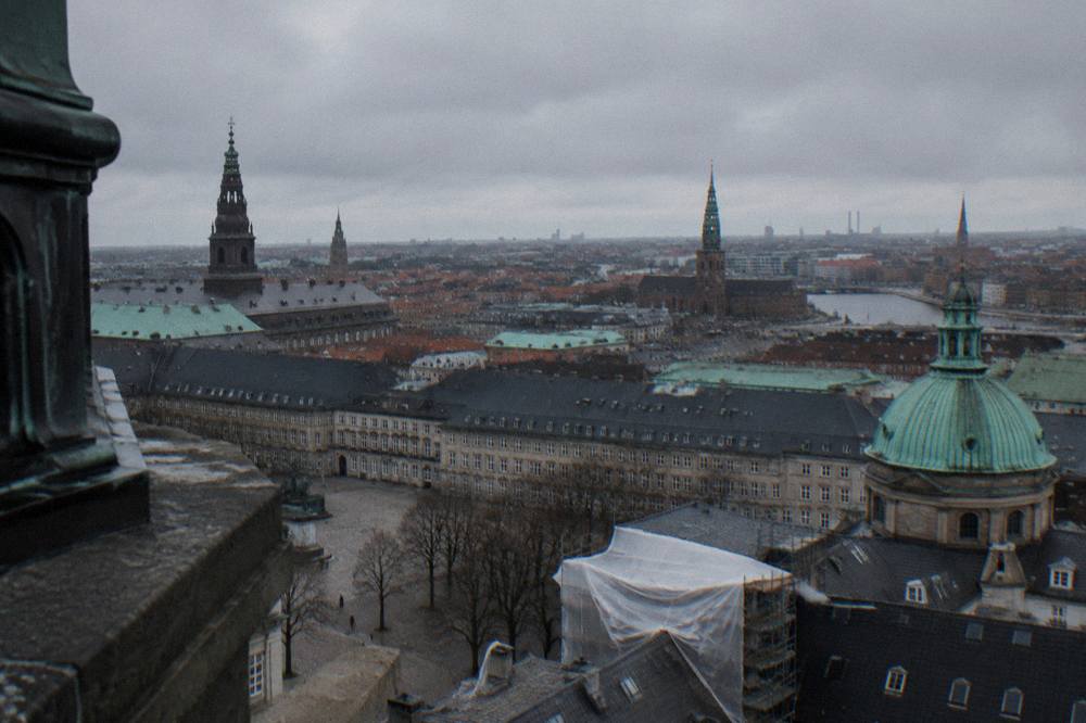Old town rooftops and church spires seen from a high viewing platform in Copenhagen